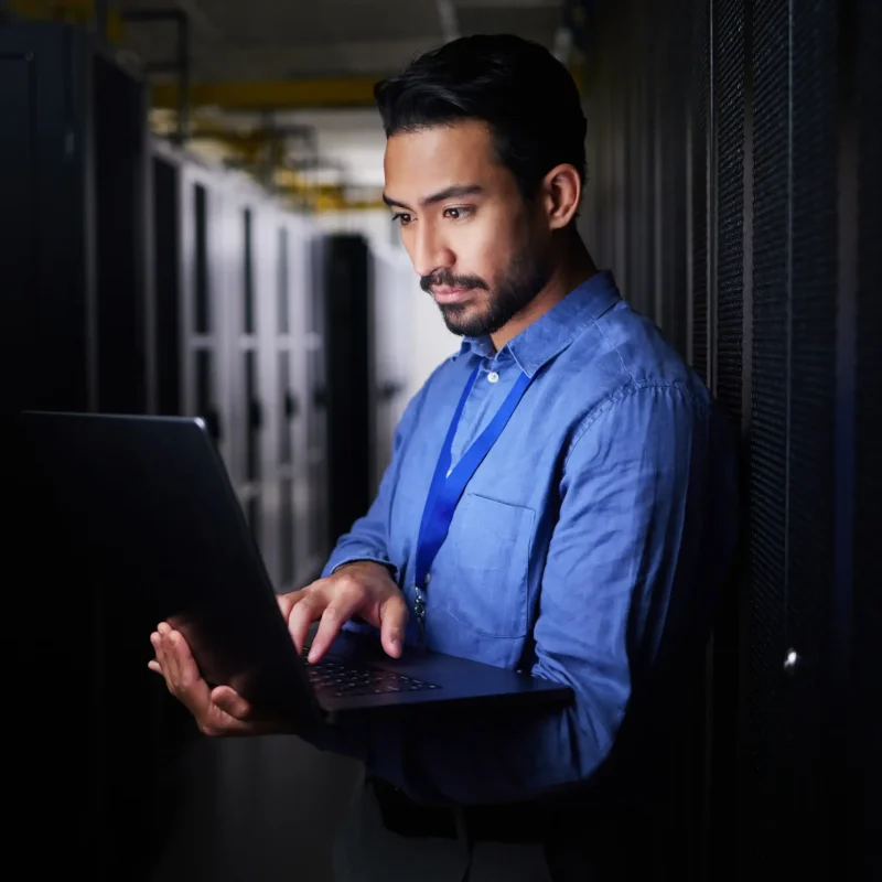 man-server-room-laptop-programming-system-management-data-center-solution-coding-night-business-person-engineering-computer-information-technology-power-check-basement