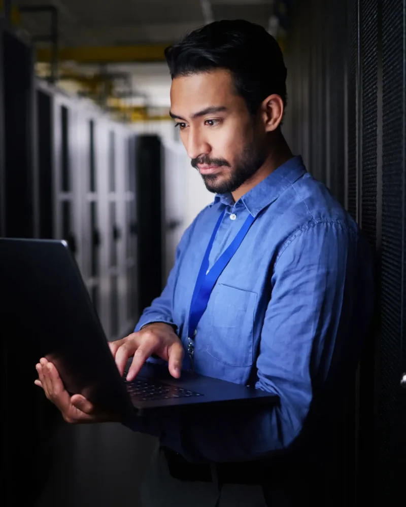 man-server-room-laptop-programming-system-management-data-center-solution-coding-night-business-person-engineering-computer-information-technology-power-check-basement